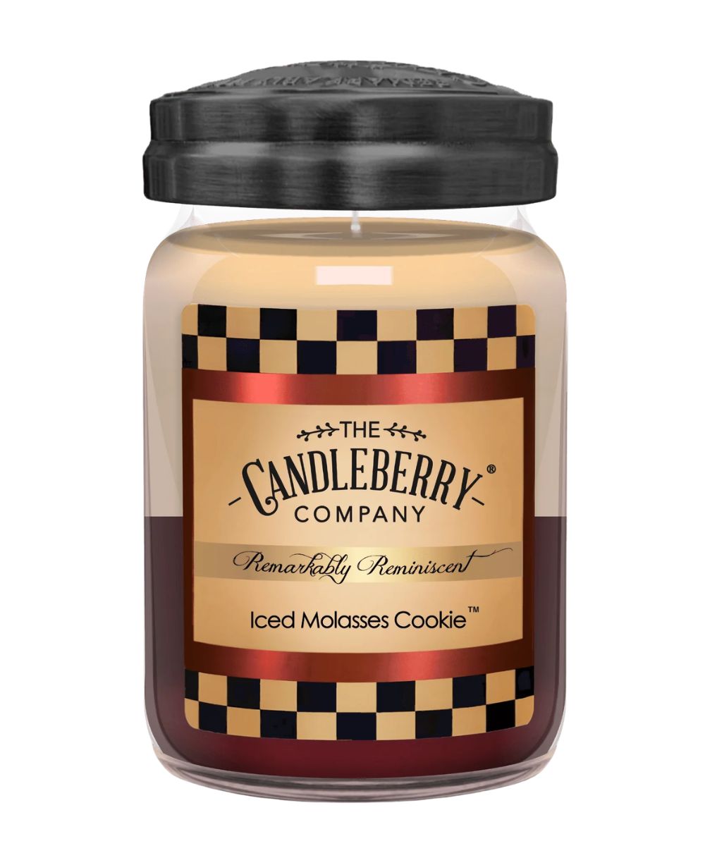 A jar candle from The Candleberry Company, scented 'Iced Molasses Cookie'. The candle has a black lid, a beige wax body, and a label featuring a tan background, black-and-beige checkered borders, and red accents.
