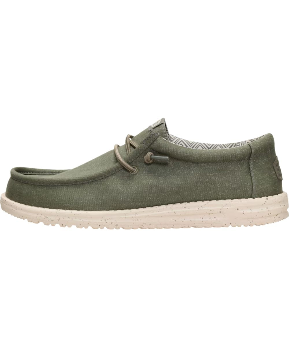Left side view of the men's tea leaf/parchment wally stretch canvas shoe