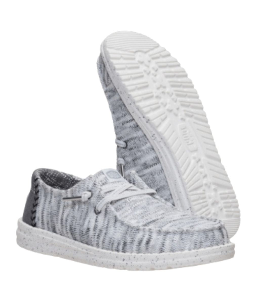 Sole view of the women's grey shoe featuring a lightweight, flexible outsole