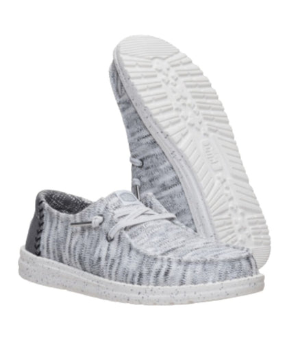Sole view of the women's grey shoe featuring a lightweight, flexible outsole