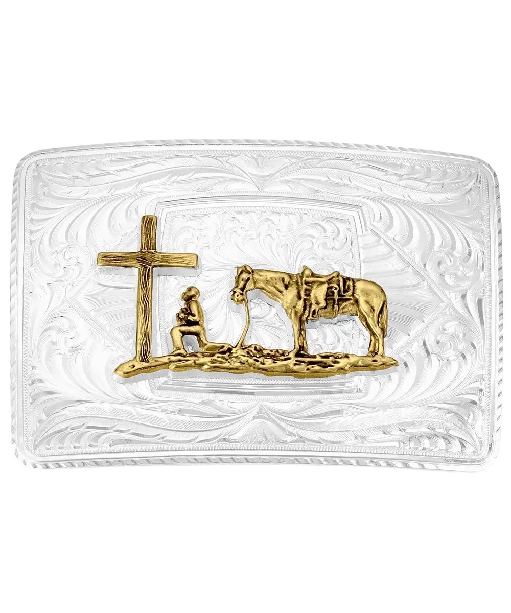 Front view of the men's silver belt buckle featuring the gold cowboy kneeling at the cross with his horse