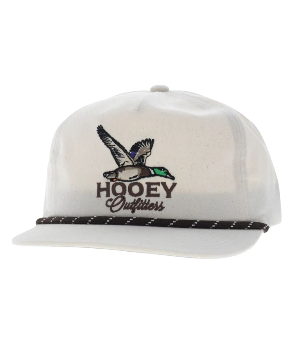 Left angled view of the unisex adult's Hooey Mallard Trucker Cap featuring the cream front with brown Hooey Outfitters Mallard logo embroidery, the cream hybrid bill with a black brim rope, and cream sides