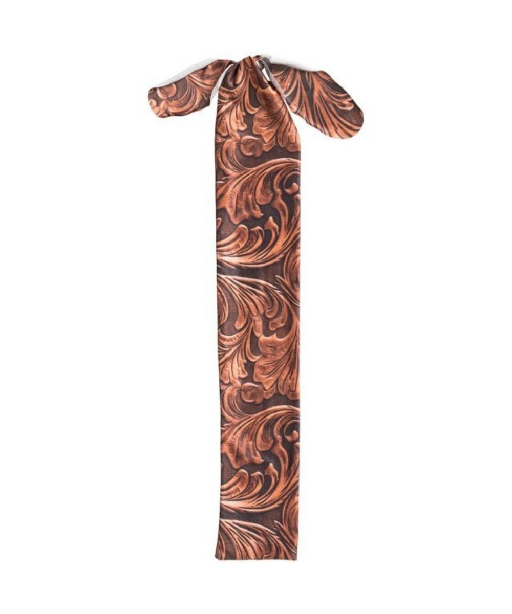 A printed tail bag with a brown tooled design
