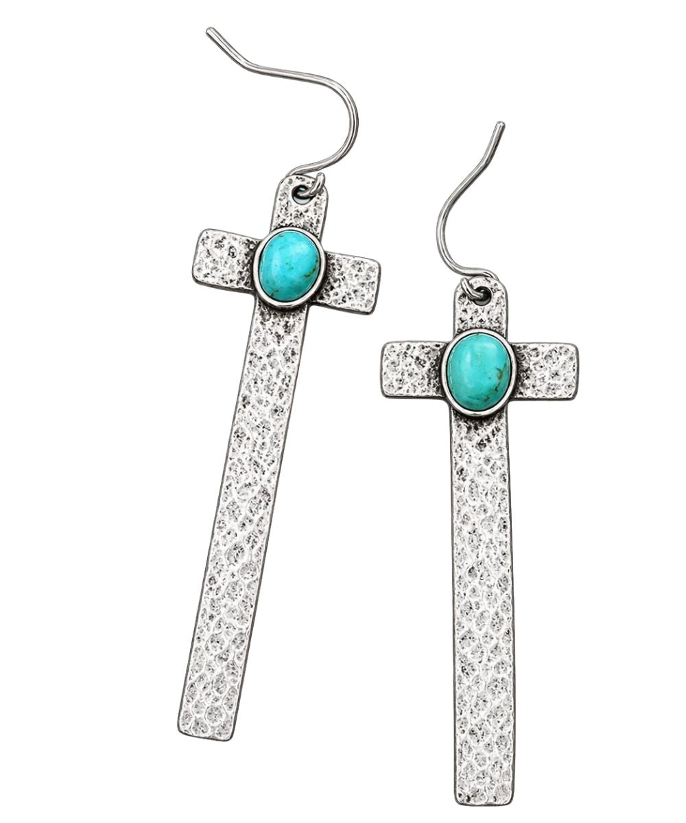 Front view of the women's silver Isac Trading Cross Earrings featuring the hammered cross shape with turquoise center stone and fishhook backs
