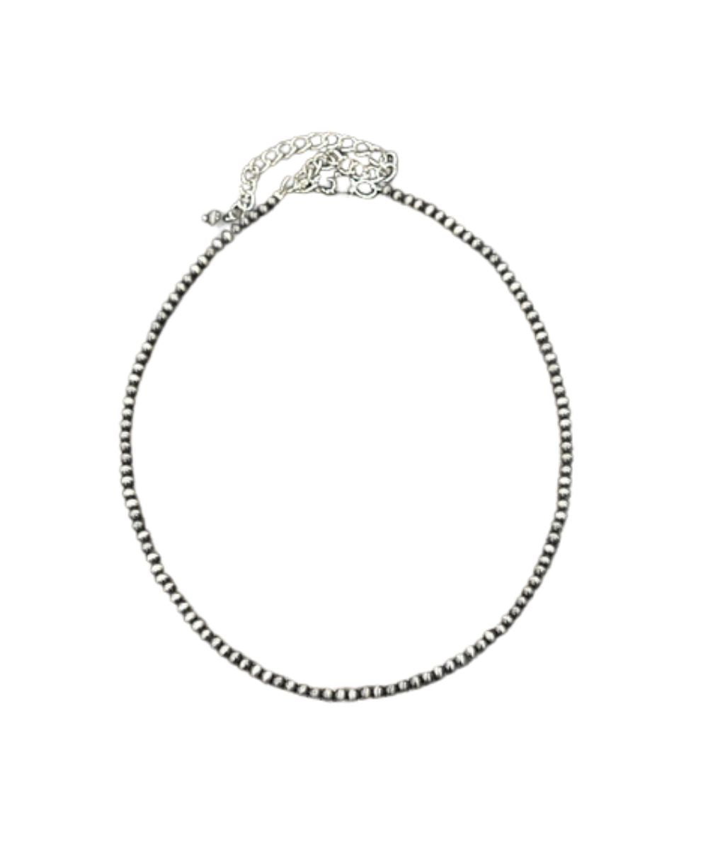 Flay lay view of the women's 16" necklace with a 5" extender