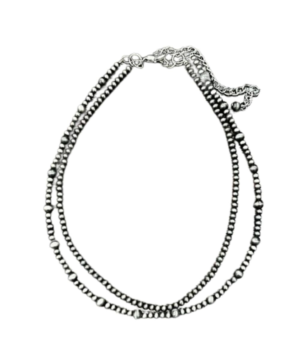 Flat view of the women's silver 16" long necklace with a 5" extender