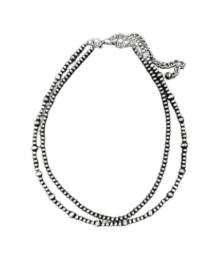 Flat view of the women's silver 16" long necklace with a 5" extender