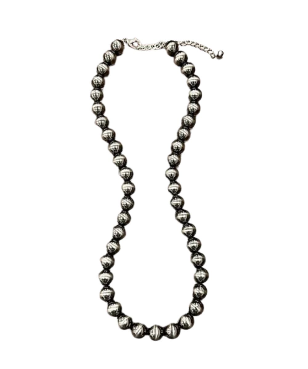 Flat view of the women's navajo-style necklace featuring the 24" length with a 5" extender and a lobster claw clasp closure
