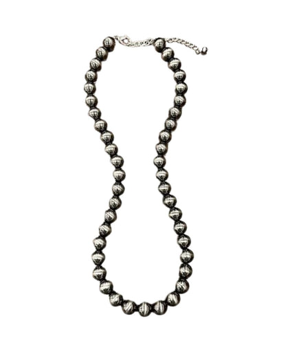 Flat view of the women's navajo-style necklace featuring the 24" length with a 5" extender and a lobster claw clasp closure