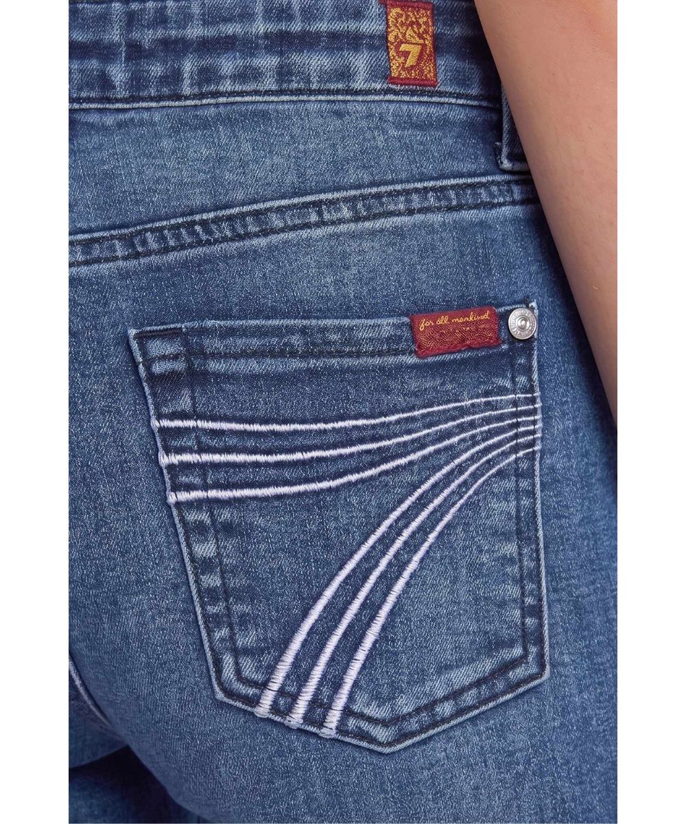 Close-up view of the light blue '7' embroidered back pocket design