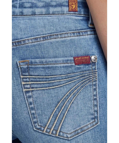 Close-up view of the '7' light blue embroidered back pocket design