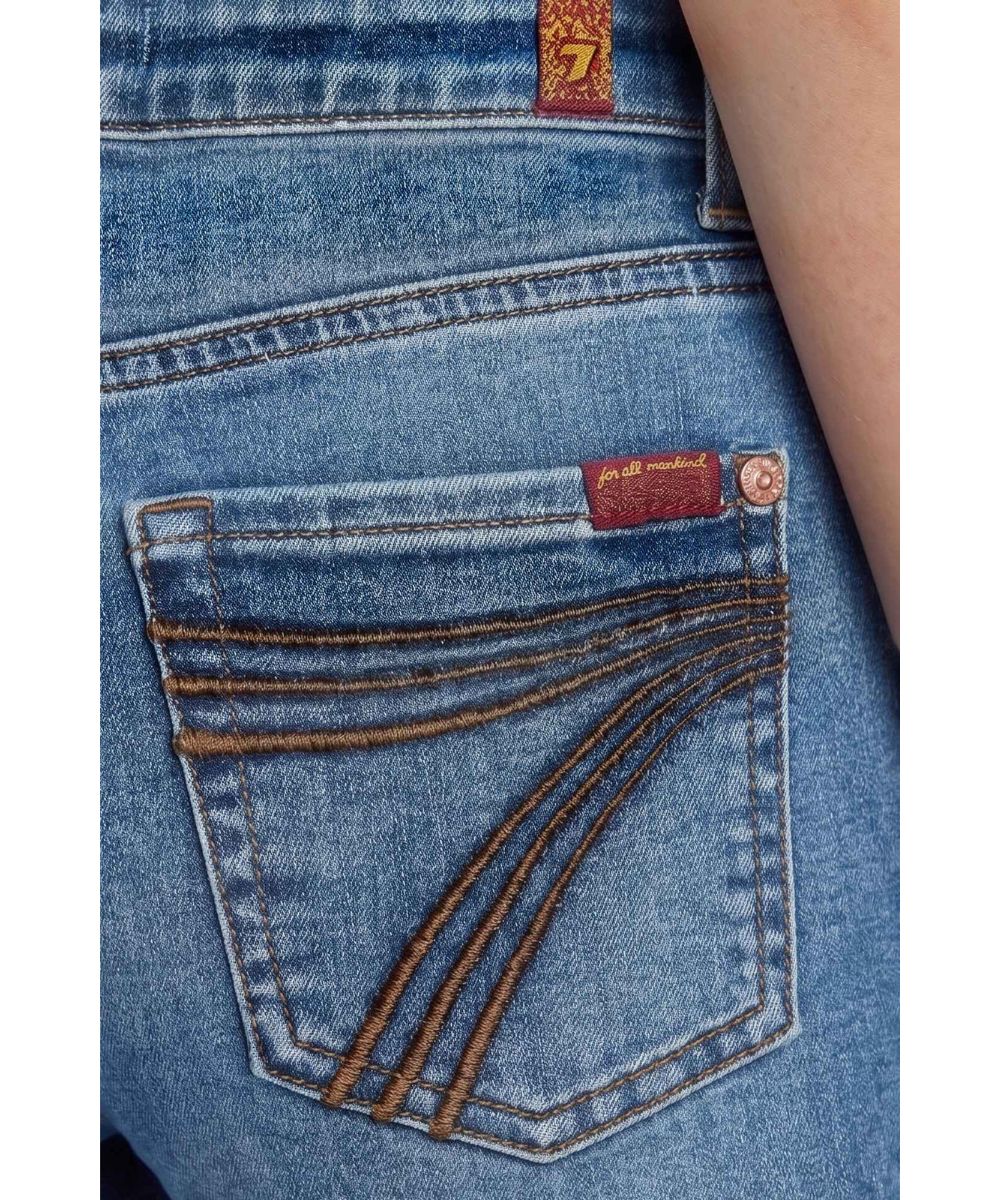 Close-up back pocket view of the signature '7' back pocket embroidery in a rich dark brown tone