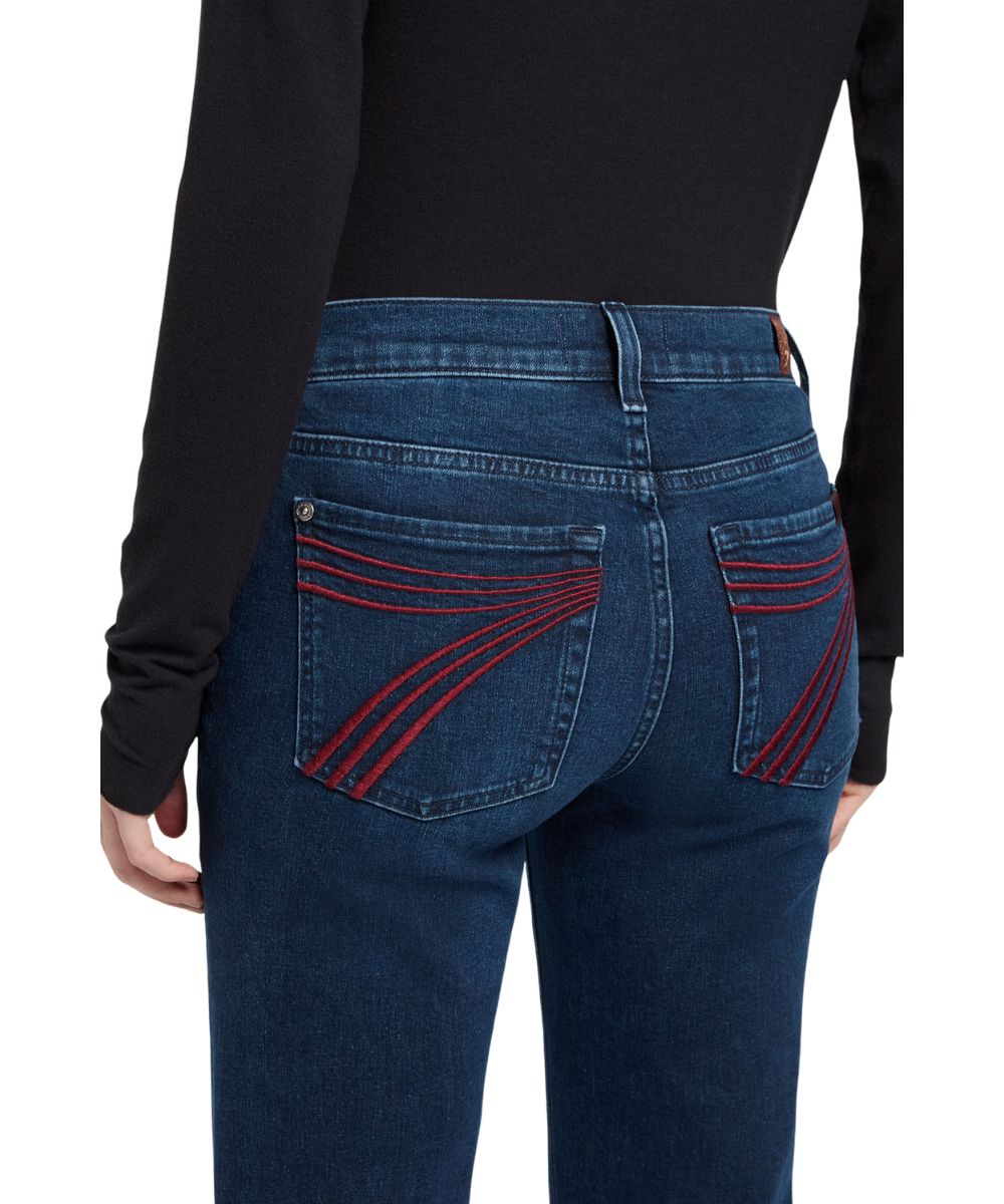 Close-up view of the signature '7' back pocket stitching in maroon