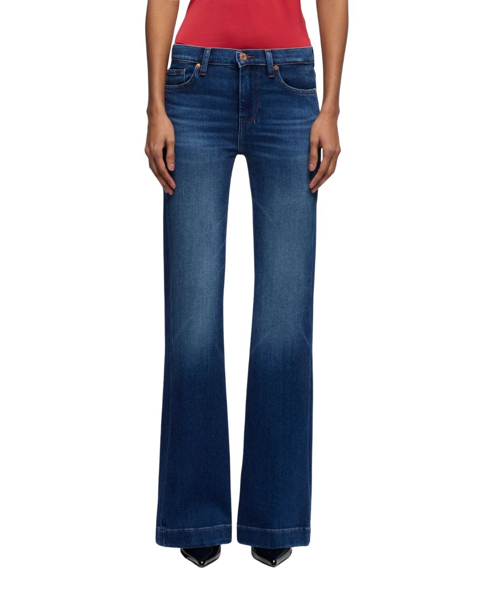 Front view of the women's slim illusion dark wash jean featuring a mid rise and whiskering and fading along the thighs