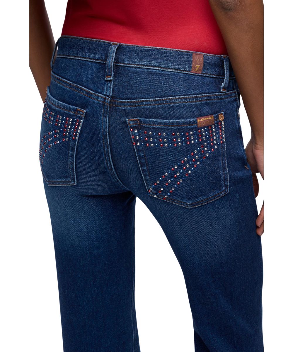 Close-up view of the red, silver, and blue crystal embellished back pockets on the women's dark wash trouser jean