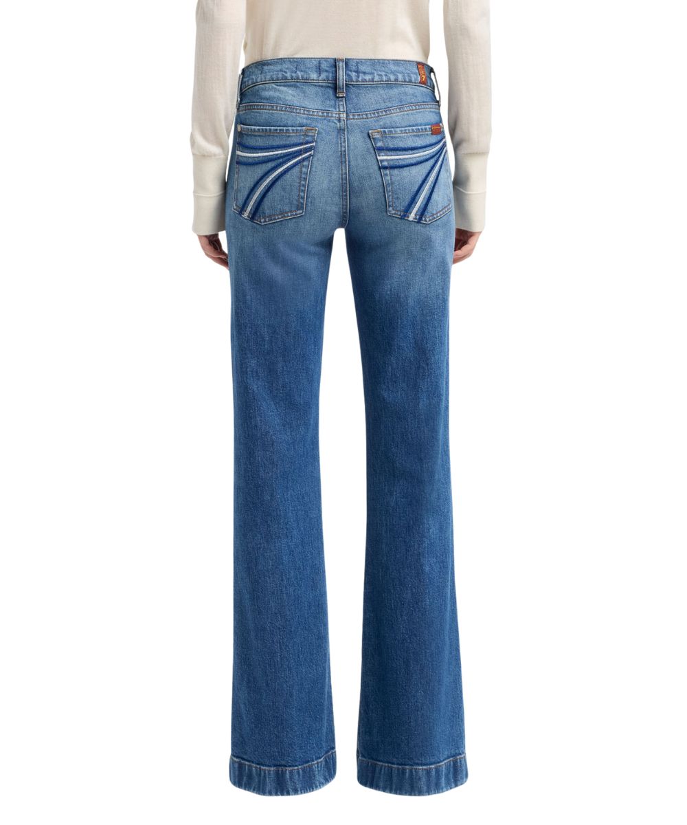 Back view of the women's mid wash flare trouser jean featuring the mid wash, mid rise, and trouser hem