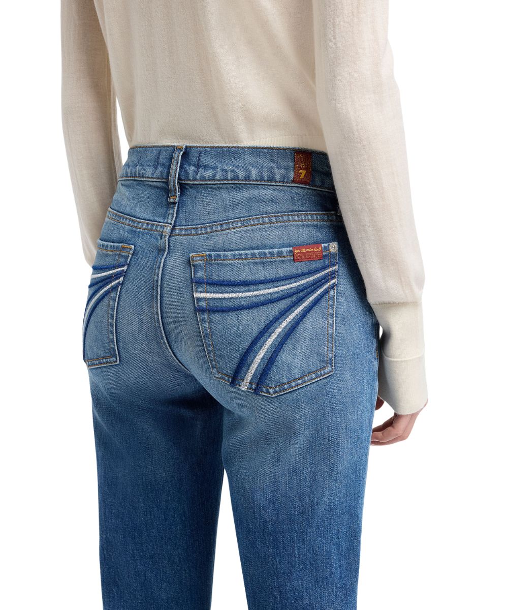 Close-up view of the back pocket featuring the signature '7' embroidery in blue and white