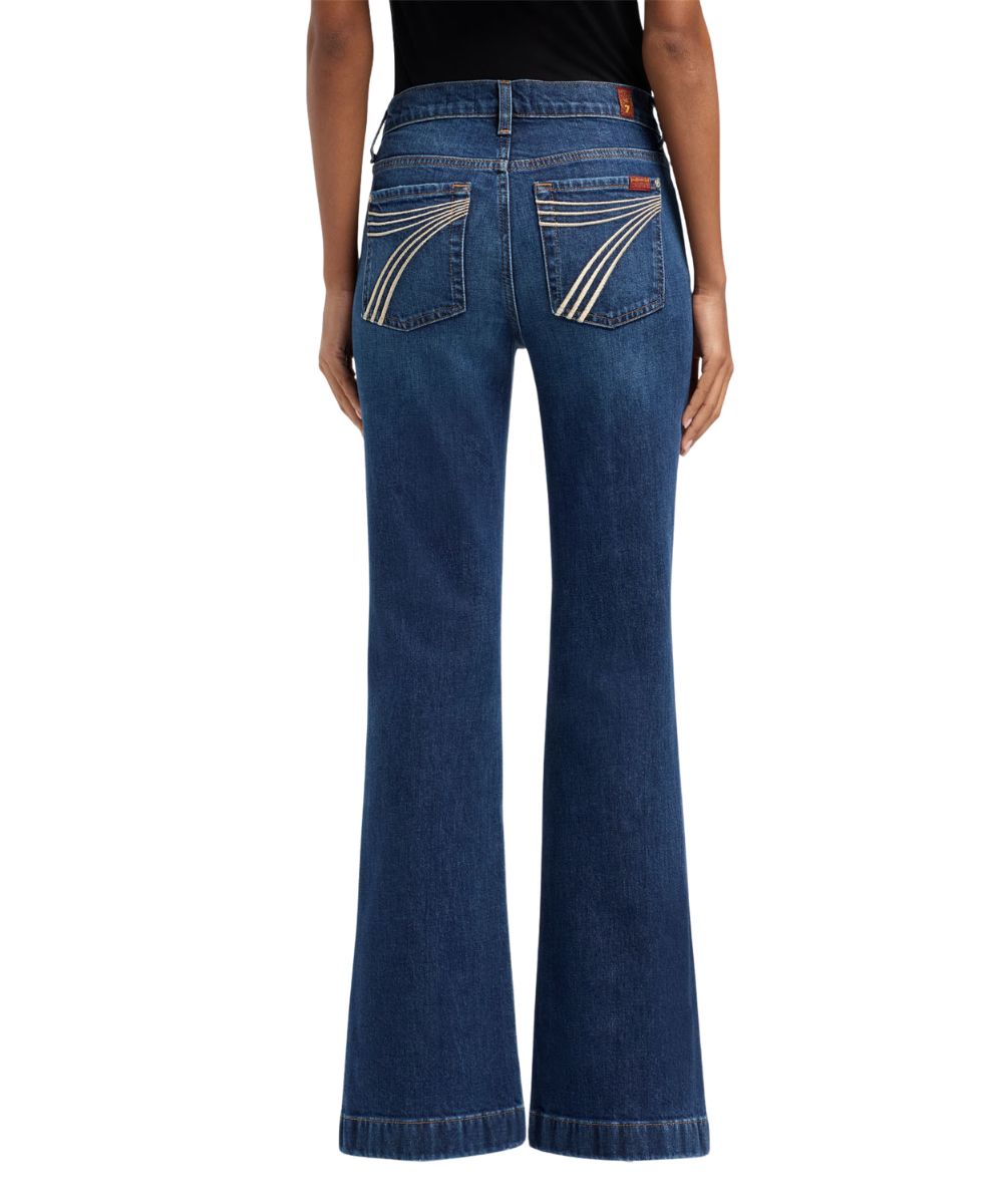 Back view of the women's medium wash indiglow flare trouser jean featuring a five-pocket styling design