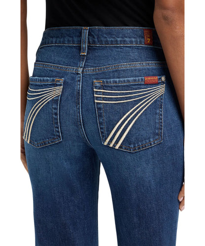 Close-up view of the white embroidered '7' back pocket design
