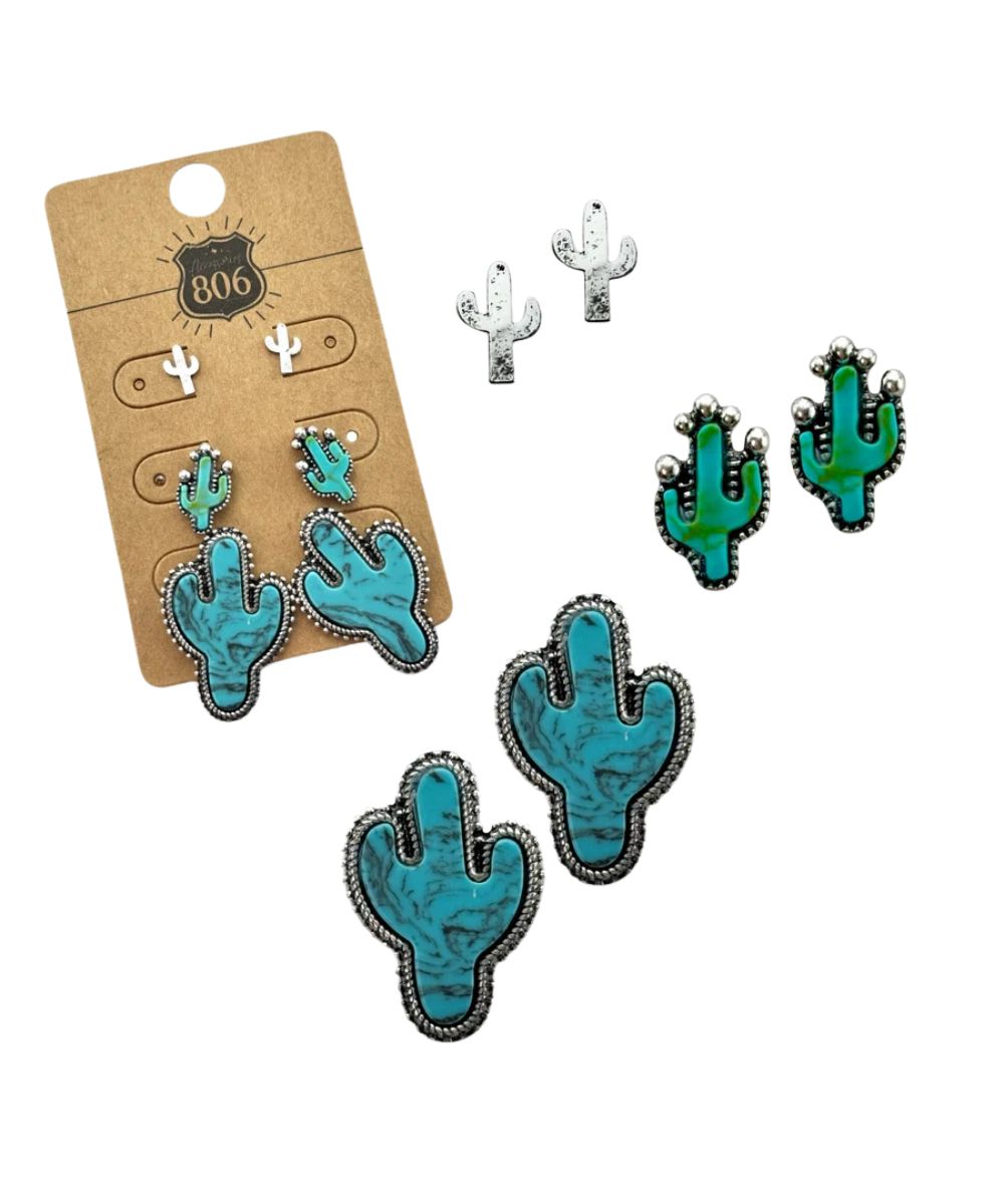 A set of turquoise and green cactus stud earrings with silver-toned borders, shown on a brown cardboard display card and as individual pieces on a white background.