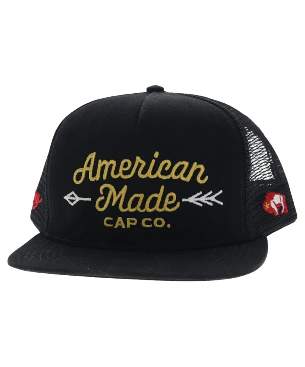 Left angled view of the unisex adult's Hooey American Made Cap Co. featuring the black front with yellow logo stitching, a black hybrid bill, and black mesh sides
