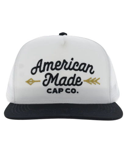 Front view of the white trucker cap featuring the 5 panel construction, and a high-profile fit