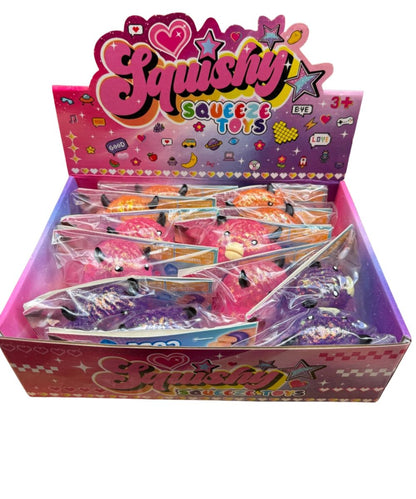 pink display of small glitter highland cows of orange, pink, and purple in clear plastic packaging
