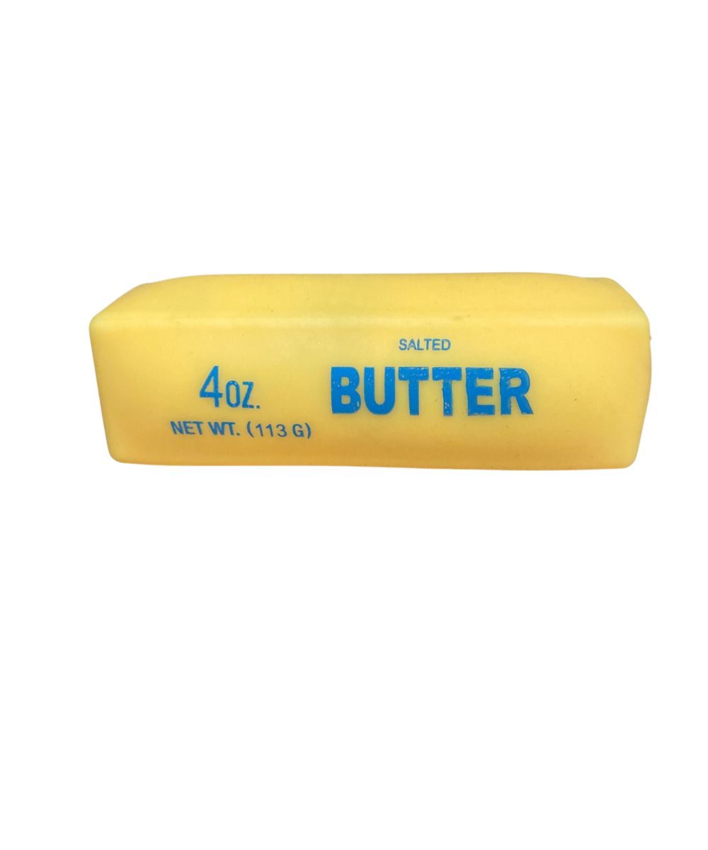 A 4 oz stick of yellow salted butter with blue text on a plain white background.