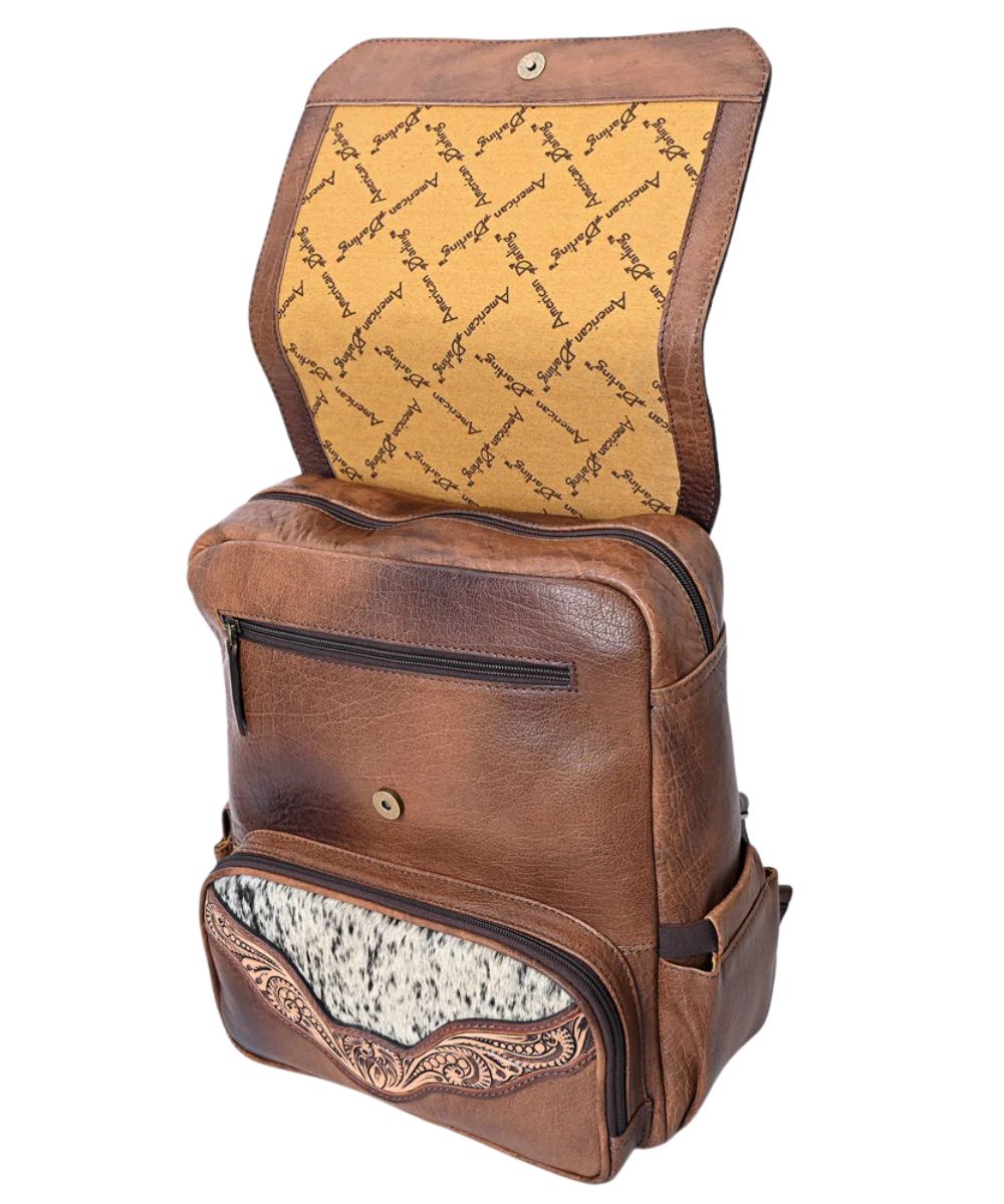 American Darling logo liner under magnetic snap flap, 2 exterior front zip pockets, side slip pockets, and a spacious main zipper compartment.