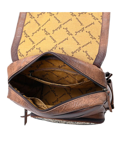 Inside the backpack is a spacious main compartment, with a zipper pocket, and slip pockets accented with the American Darling logo liner.