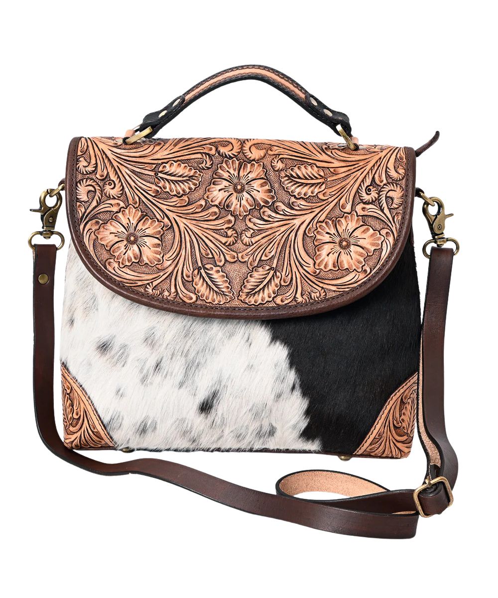 American Darling women's messenger bag featuring floral tooling and hair-on cowhide construction. 
