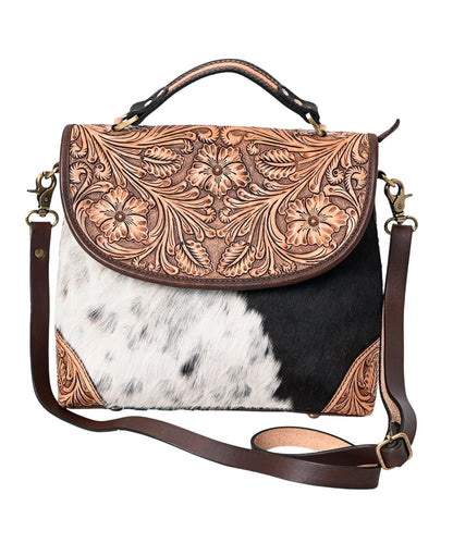 American Darling women's messenger bag featuring floral tooling and hair-on cowhide construction. 