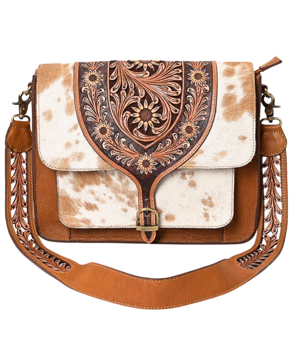 Women's hair-on cowhide leather messenger bag featuring sunflower tooling, by American Darling.