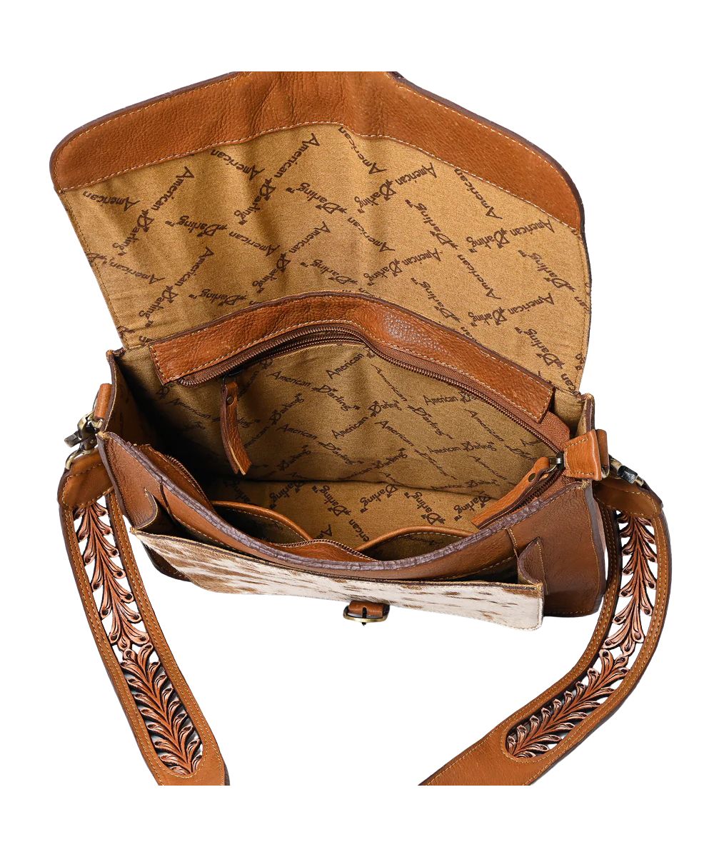 Spacious interior, removable shoulder strap, zip closure, and a flap cover with pocket underneath.