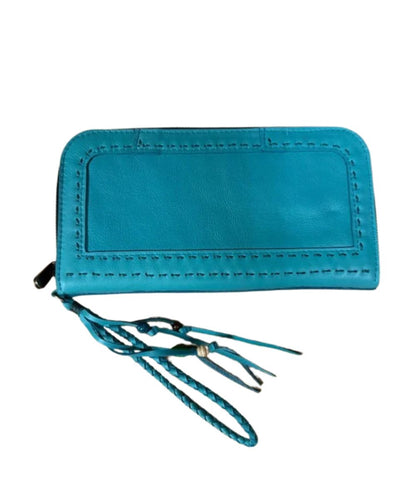 A mint green leather zip-around wallet with a braided wristlet strap and leather tassel decoration