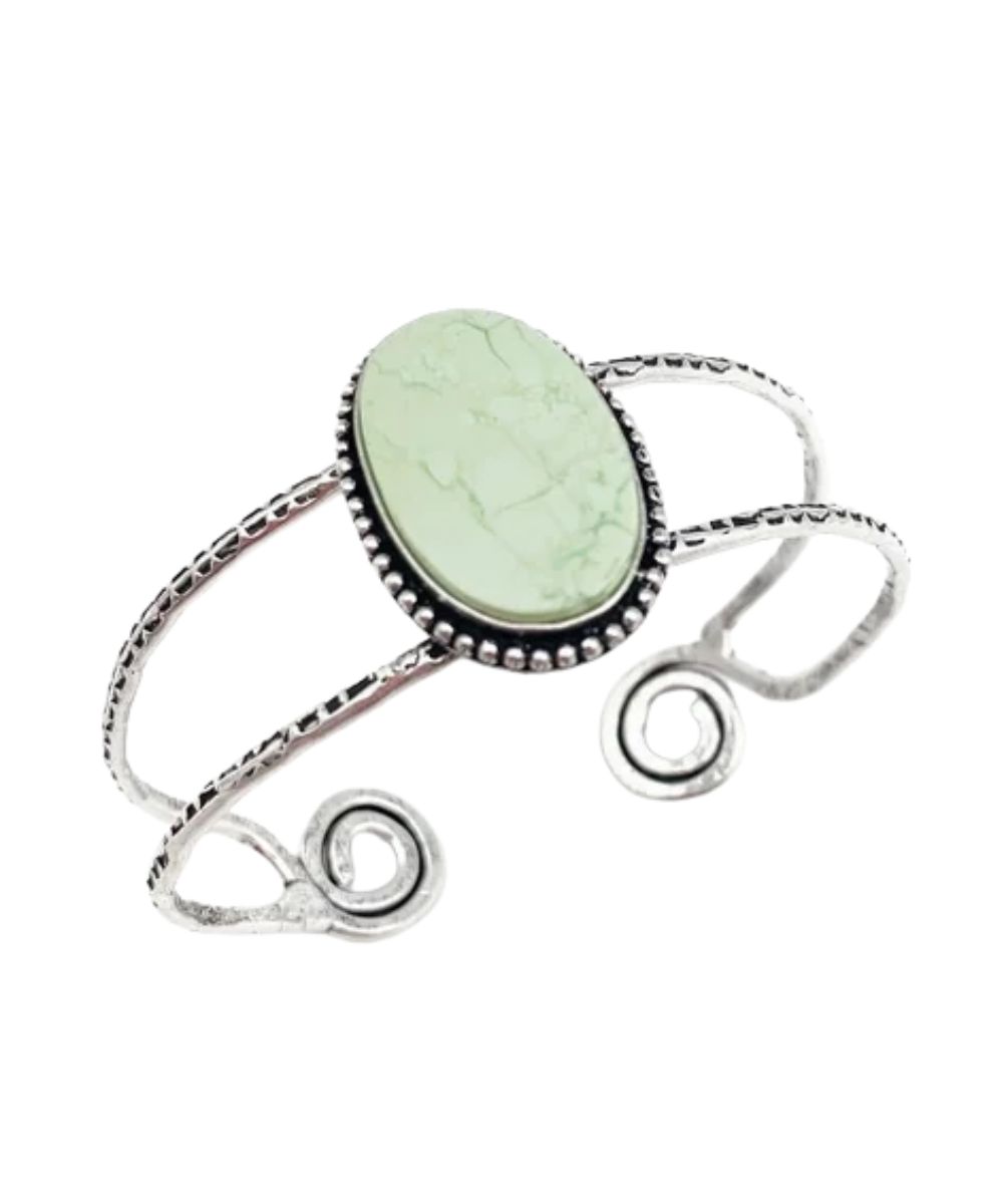 Top view of the women's semiprecious lemon chrysoprase stone in a bezel setting silver-plated brass featuring the open back design by Anju Jewelry