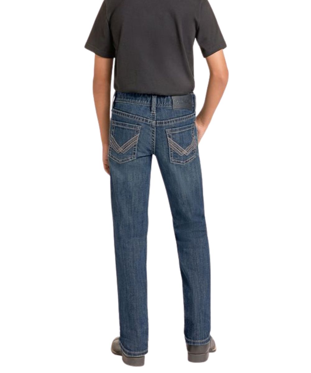 Back view of the boy's dark wash revolver jean featuring the internal adjustable waistband, slim fit, and mid rise