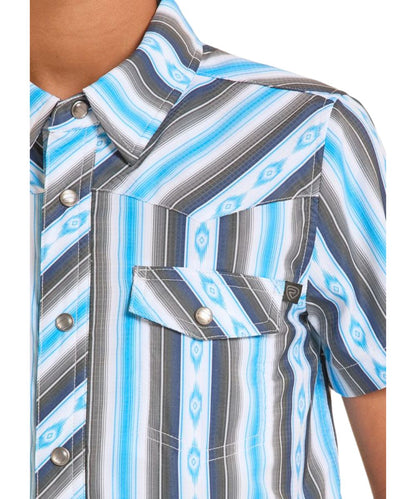 Close-up view of the boy's short sleeve snap shirt featuring a white and blue mini aztec retro striped print on breathable, moisture wicking fabric