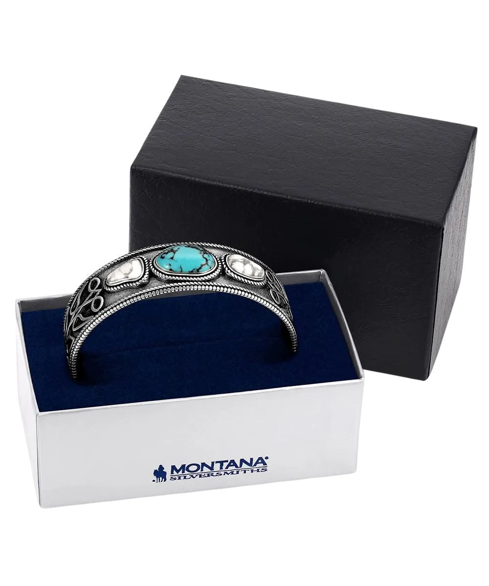 Boxed view of the women's boot stitch turquoise cuff bracelet by montana silversmiths