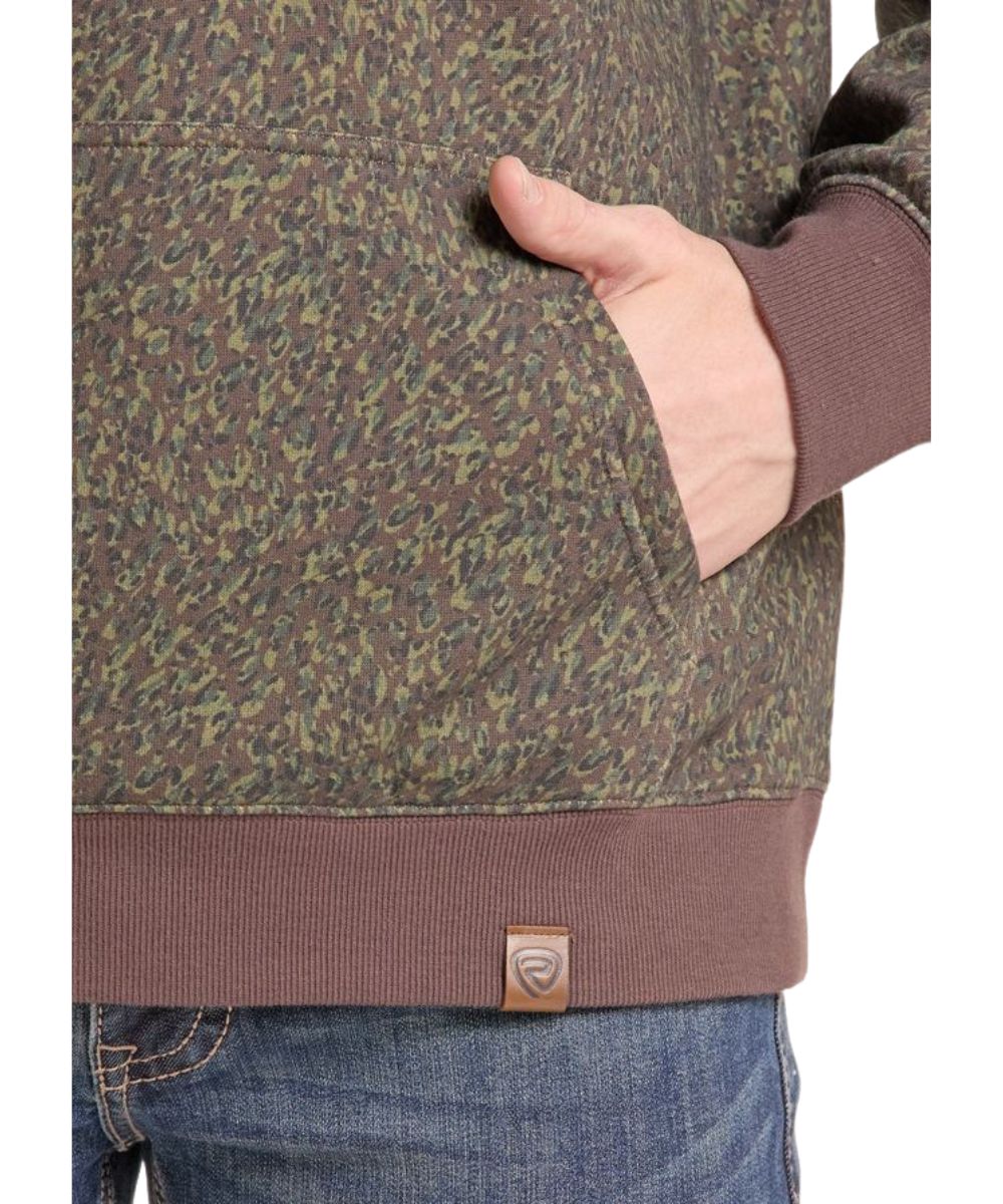 Close-up view of the olive camo print and brown contrast rib knit trim