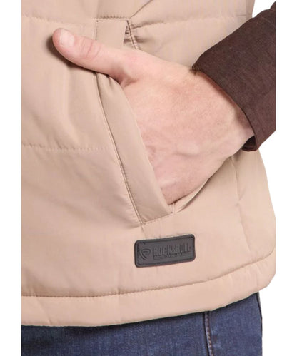 Close-up view of the tan polyester vest featuring the hand pockets
