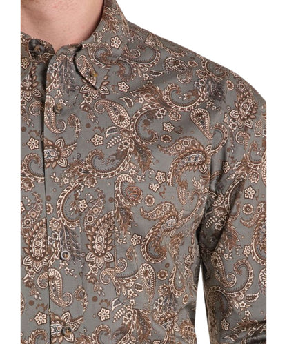 Close-up view of the men's dark brown paisley button down shirt featuring the button-down collar and single open chest pocket