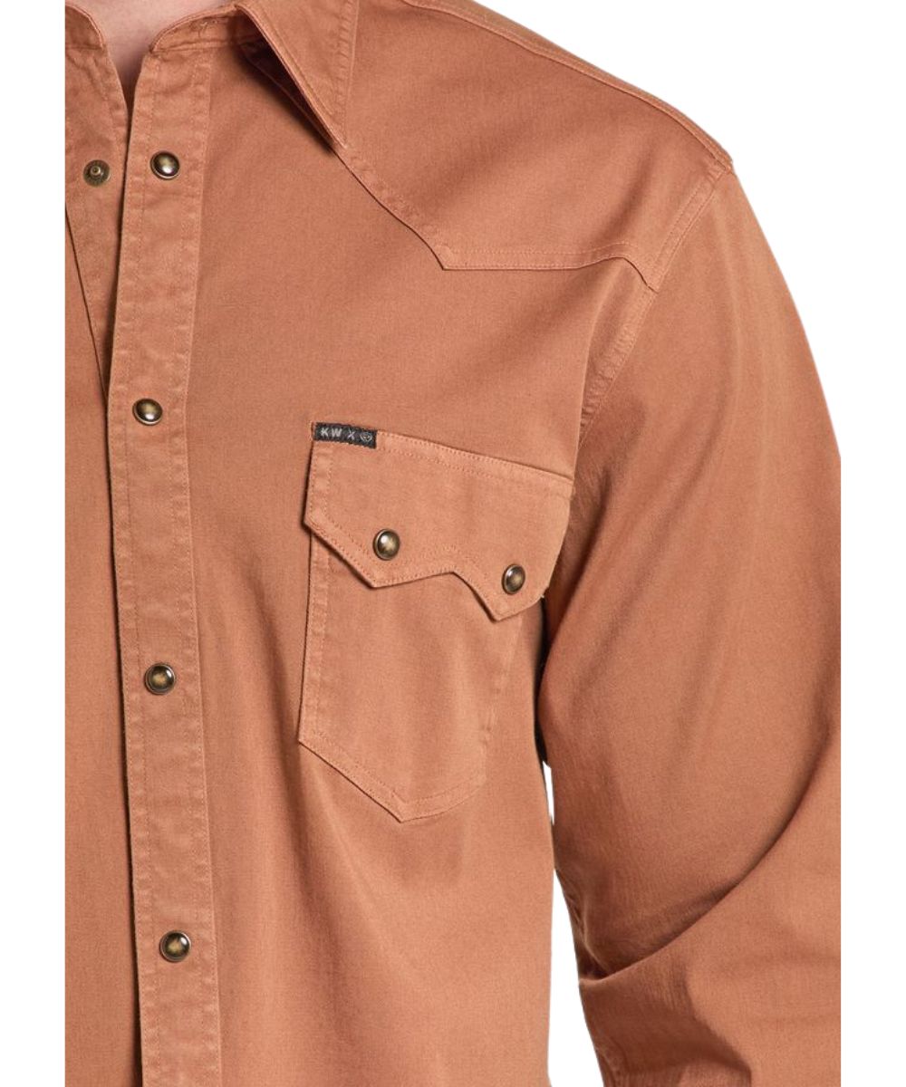 Close-up view of the solid camel shirt featuring the western yokes, snap closure, and chest pockets