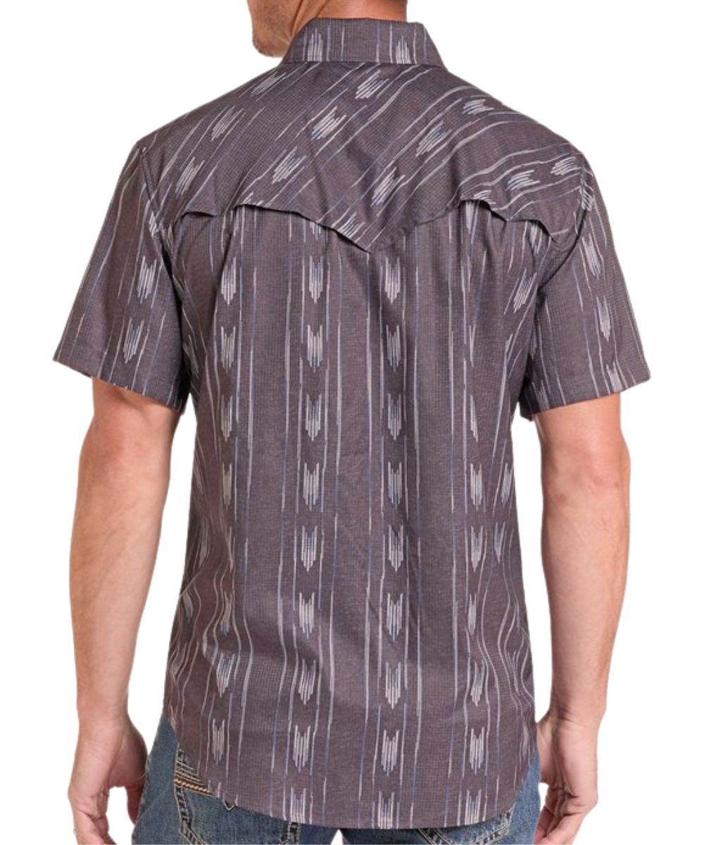 Back view of the men's short sleeve snap shirt featuring the black ikat striped print, vented back yoke, and moisture wicking properties