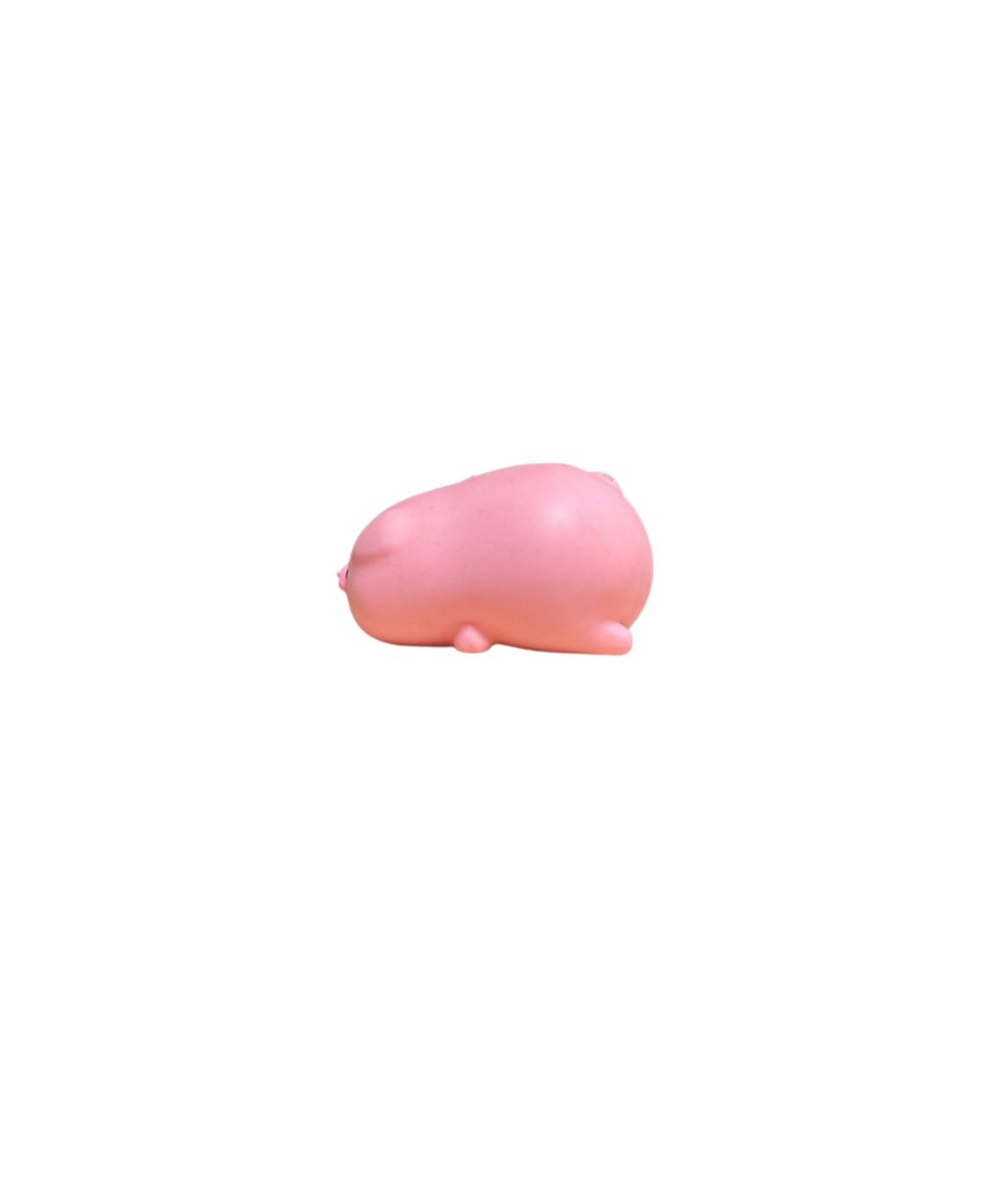 side view of a small pink pig squish toy