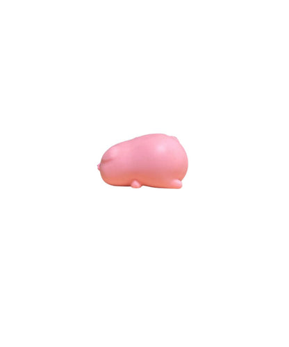 side view of a small pink pig squish toy