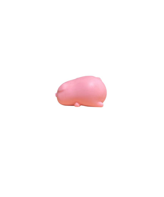 side view of a small pink pig squish toy