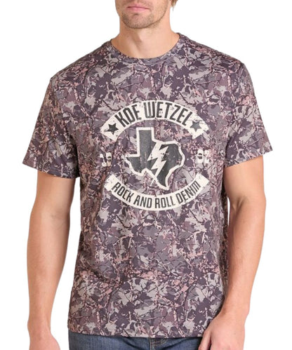 Front view of a man modeling the camo graphic tee featuring the Koe Wetzel Texas logo screen-printed graphic on the front