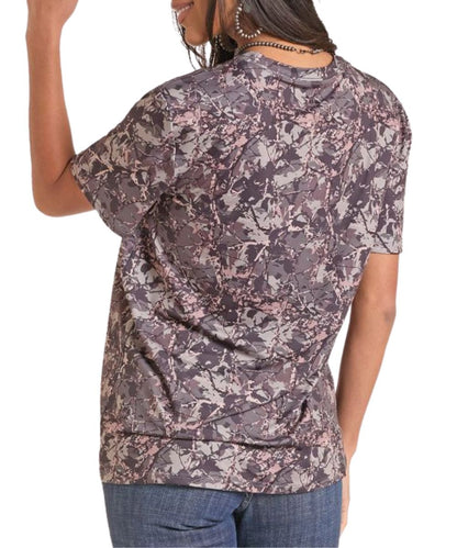 Back view of a woman modeling the camo/olive graphic knit tee