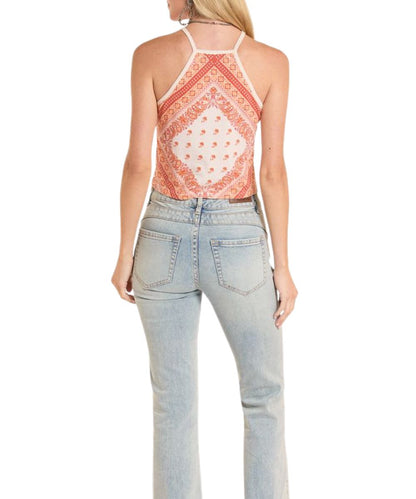 Back view of women's burnt orange paisley halter top featuring spaghetti straps and a straight back hem.